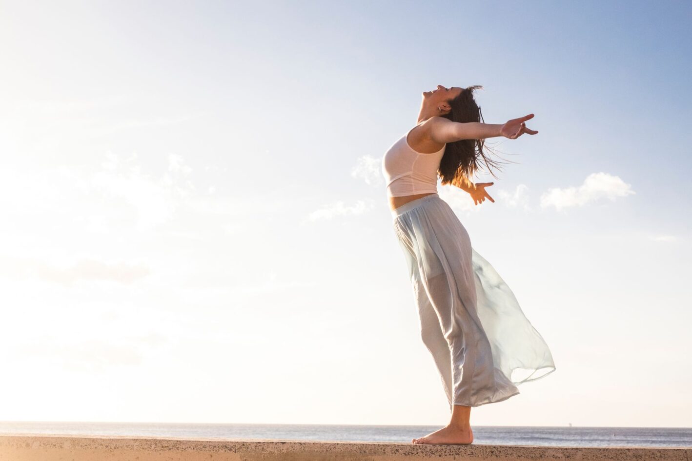 Freedom and empowerment female concept with young girl standing